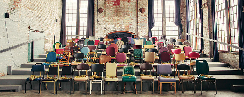 Mix matched chairs in a 19th century factory