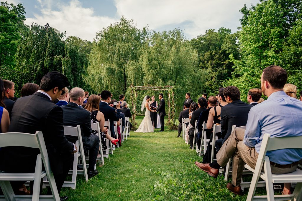 Ceremony by Lake at Buttermilk Inn and Falls